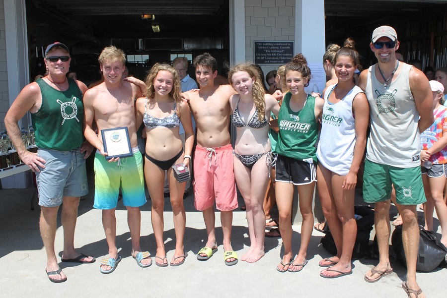 Members of the Wagner Aquatic Club in Staten Island, NY, took home the first place prize in the “Swim Club” team division during the Sea Isle City Beach Patrol’s annual 1-Mile Ocean Swim on July 23. The winners are shown with SICBP Assistant Captain John Temme (far left) and SICBP Senior Guard Dave Novak, race organizer (far right). 