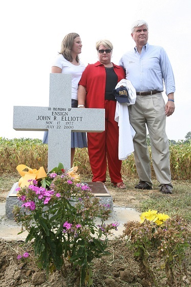 082506 Elliott Memorial Rededication 4 Staff photo by Joe Kmetz John and Muriel Elliott stand with their daughter Jennifer at the rededication of the memorial for their son U.S. Navy Ensign John R. Elliott was was killed by a drunk driver in July 2000 at the site at Slabtown Road and U.S. Route 40 in Upper Pittsgrove on Friday.
