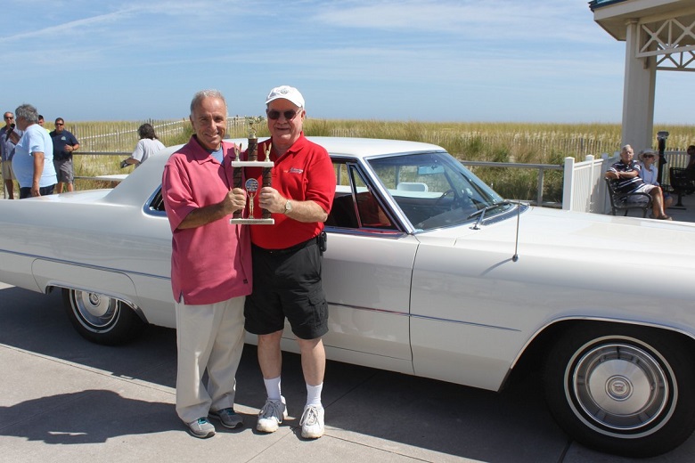 Steve Saylor, of Ocean View, NJ, (at left) is shown receiving the “Mayor’s Choice” trophy from Mayor Leonard Desiderio on September 18. Mr. Saylor’s 1966 Cadillac Coupe DeVille was among the many vehicles entered in the festival’s Gerard A. Desiderio Antique Auto Show. 