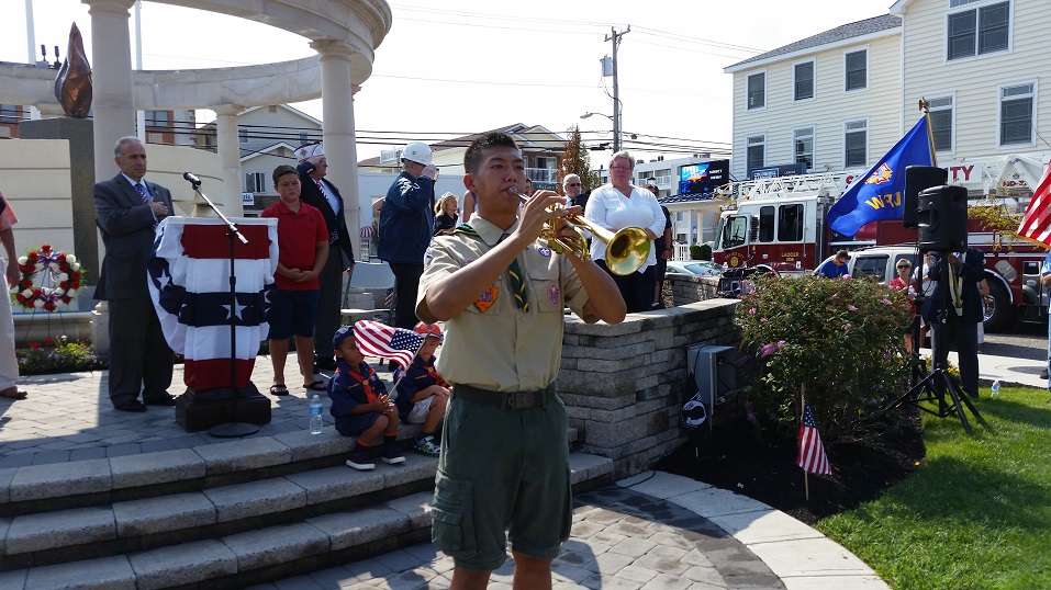 Eagle Scout Forest Wan, of Troop 76, played "Taps" in remembrance of the 9/11 victims.