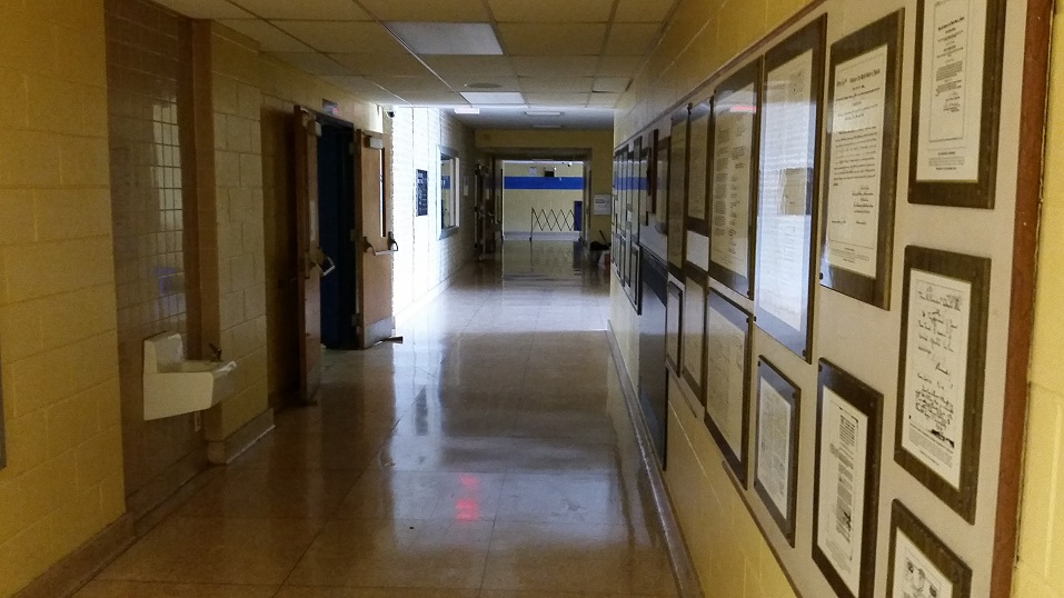 Once filled with children, the hallways are now dark and empty.