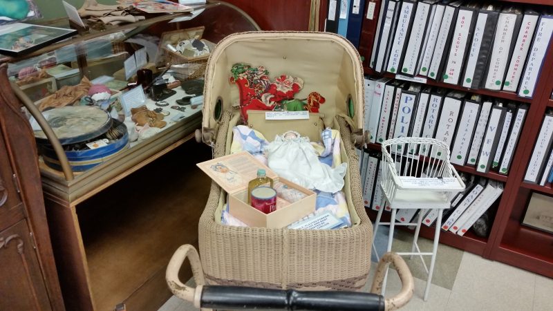 An old-fashioned baby cradle was decorated for the holidays.