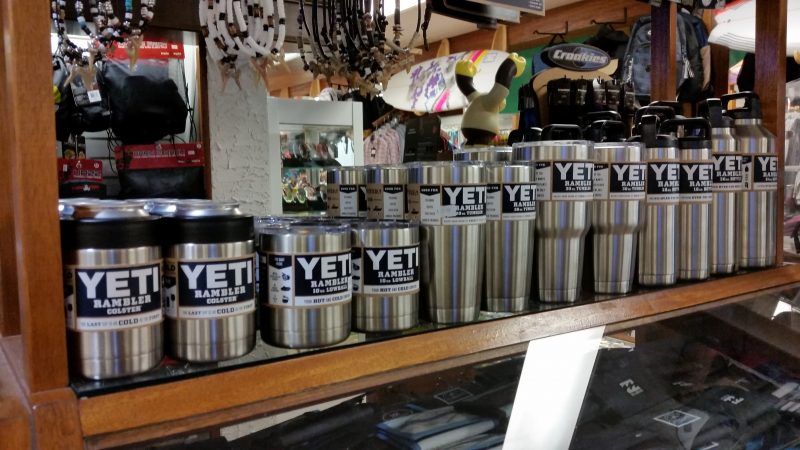 Yeti can holders and beverage containers are popular with commuters because they keep drinks cold or hot during long trips.