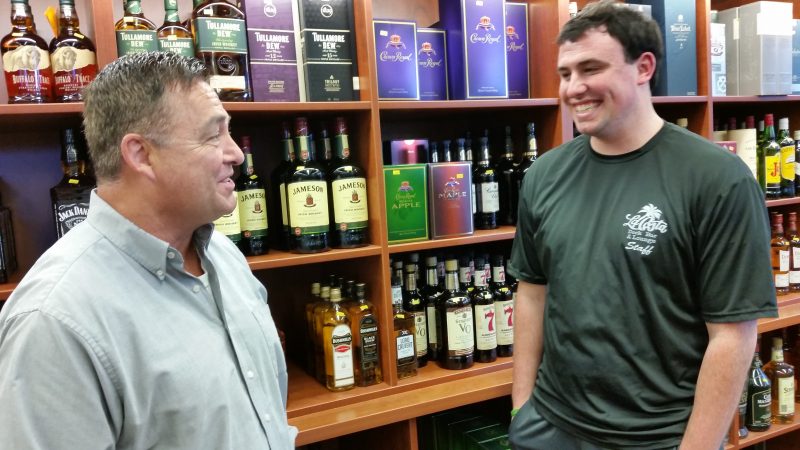Bennett shares a laugh with employee Patrick McLaughlin.