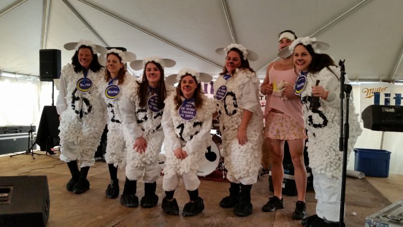 The "Serta Sheep" cavort on stage during the costume contest.