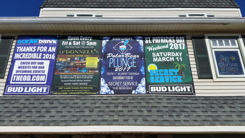 The Ocean Drive bar uses a Polar Bear Plunge-themed sign to advertise its entertainment lineup.