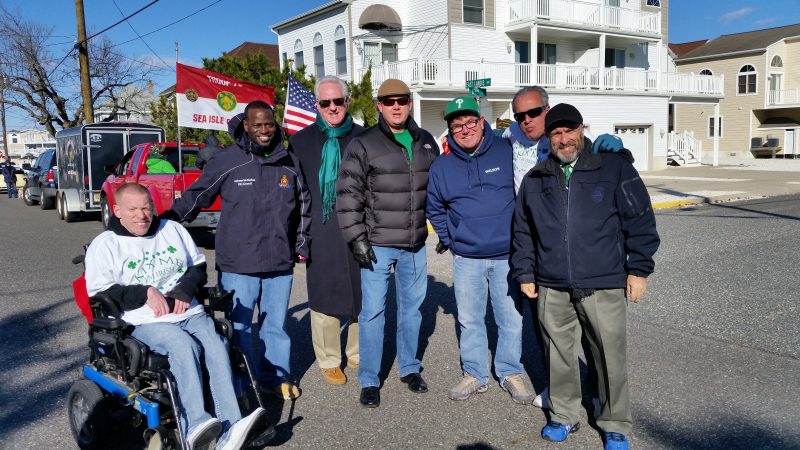 Ocean City Councilmen Bob Barr, Antwan McClellan, Michael DeVlieger, Tony Wilson and Keith Hartzell, joined with Cape May Freeholder Jeff Pierson, in green scarf, and Sea Isle Mayor Leonard Desiderio, at right.