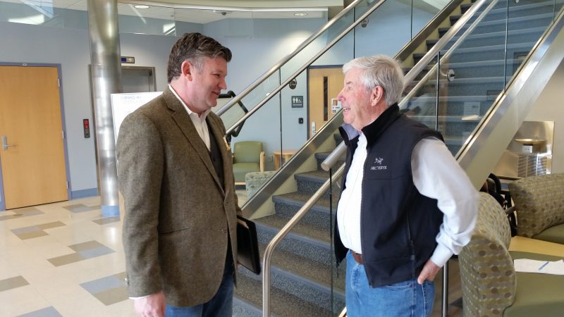 Chamber of Commerce President Christopher Glancey, left, talks to Councilman John Divney about promoting Restaurant Week and outdoor dining.
