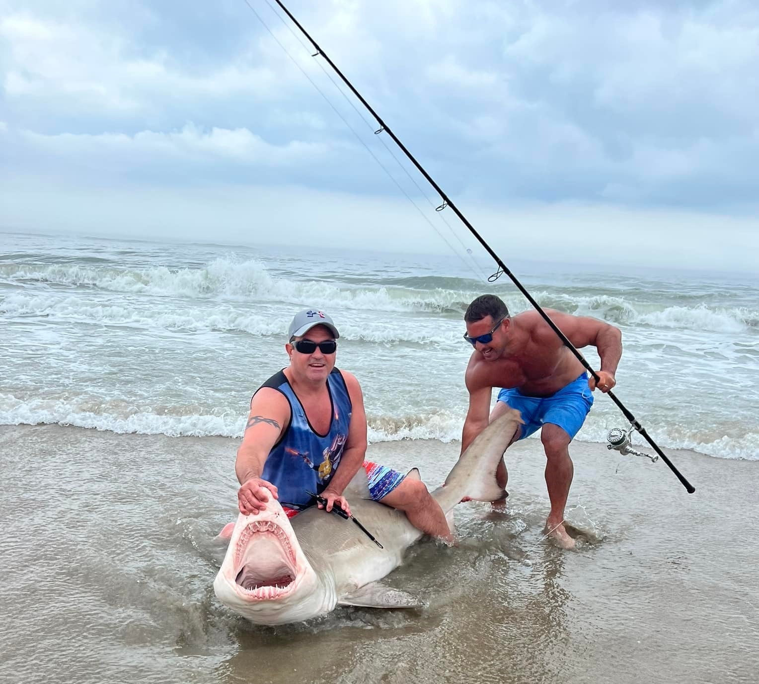 https://seaislenews.com/wp-content/uploads/sites/3/2022/07/1.4-Shark-caught-by-fishermen.jpg
